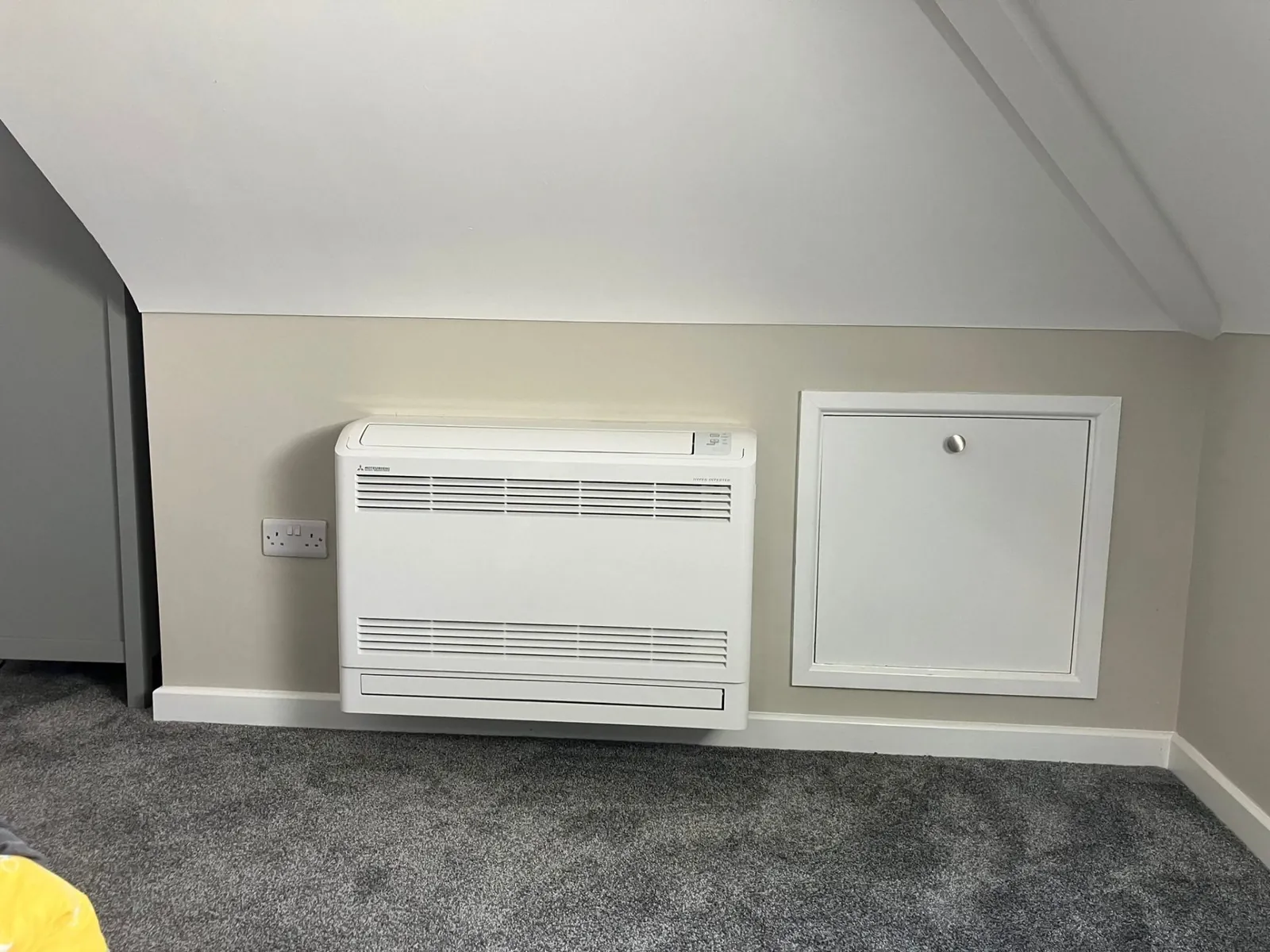 Mitsubishi floor-mounted AC unit in loft bedroom
