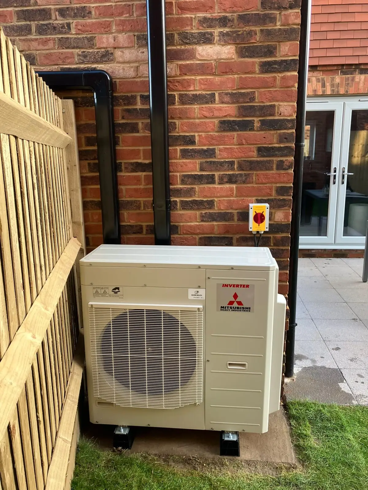 Mitsubishi outdoor condenser unit with pipework