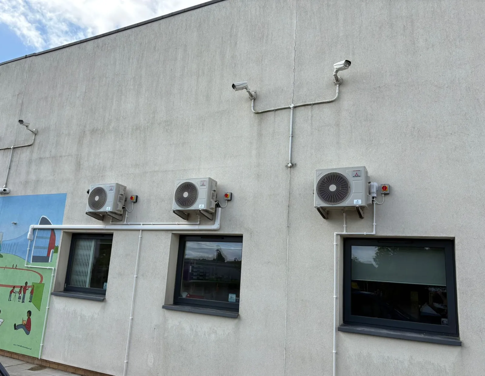 Multiple Mitsubishi outdoor condensers on commercial building
