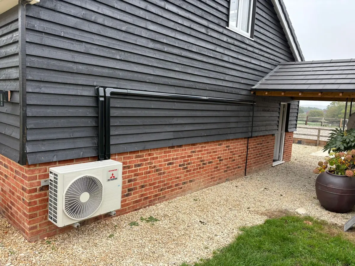 Mitsubishi outdoor unit on barn conversion