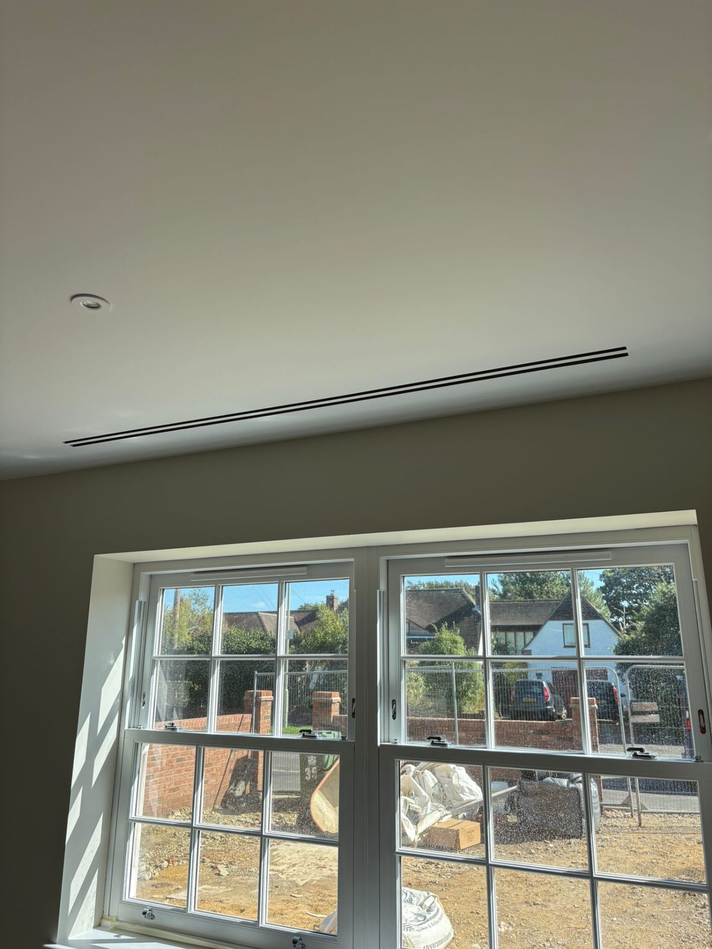 Linear slot diffuser ducted AC above windows