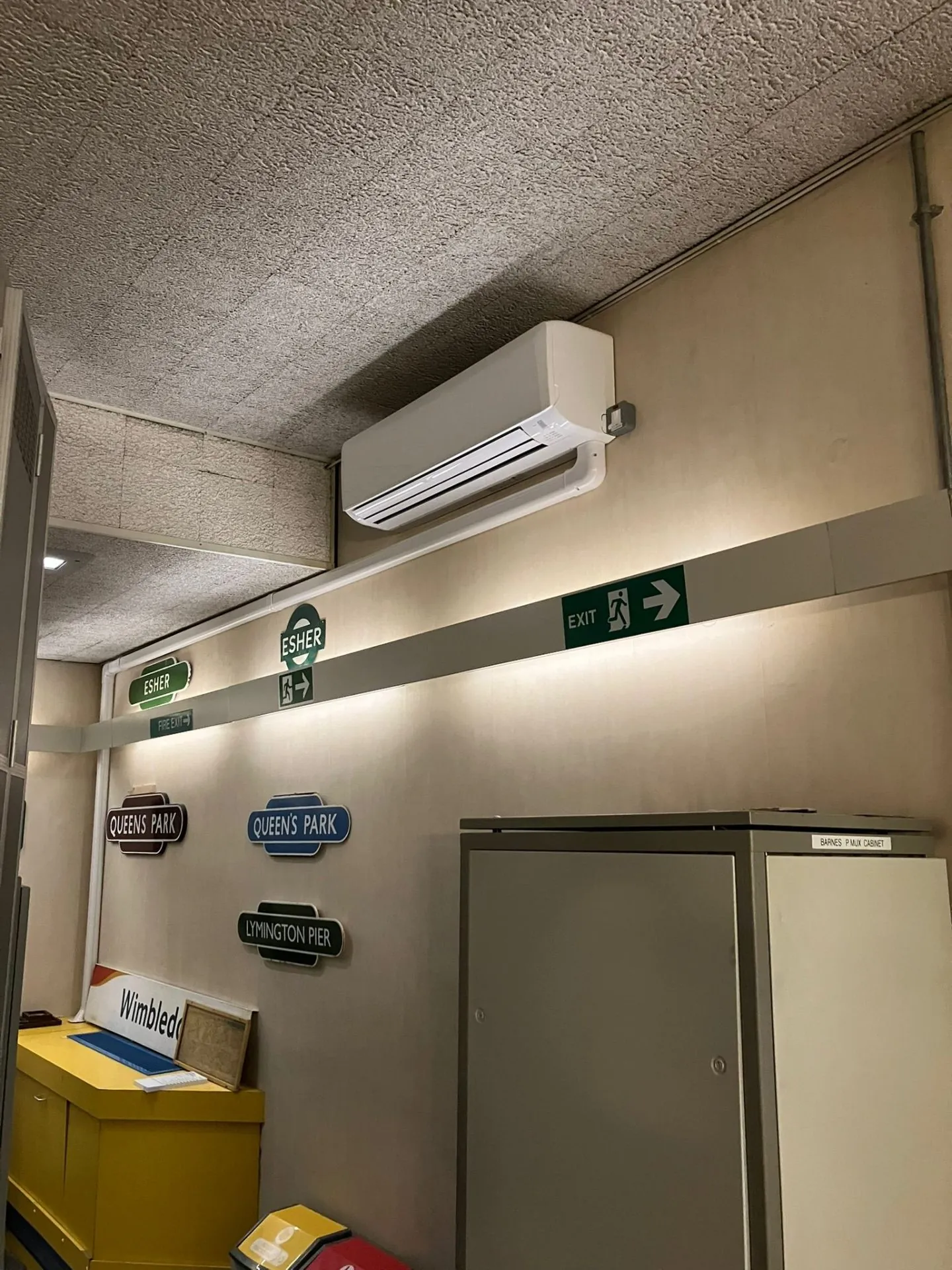 Wall-mounted AC unit in commercial storage room
